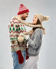 Image showing happy couple at christmas ugly sweater party