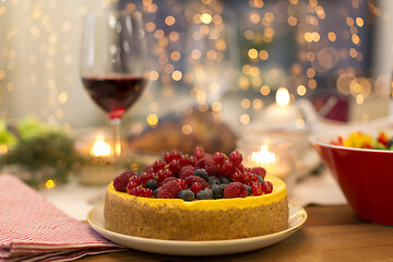 Image showing cake and other food on christmas table at home