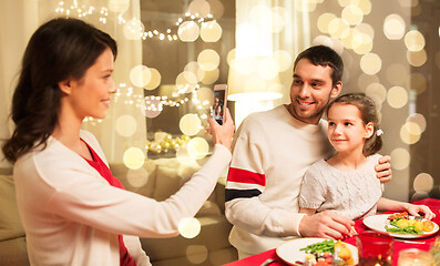 Image showing happy family taking picture at christmas dinner
