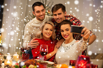 Image showing friends taking selfie at christmas dinner