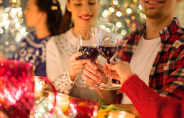 Image showing close up of friends with wine celebrate christmas