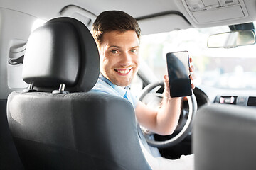 Image showing man or car driver showing smartphone