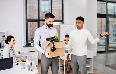 Image showing executive seeing off sad fired male office worker