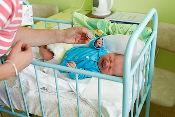 Image showing crying newborn baby infant in the hospital