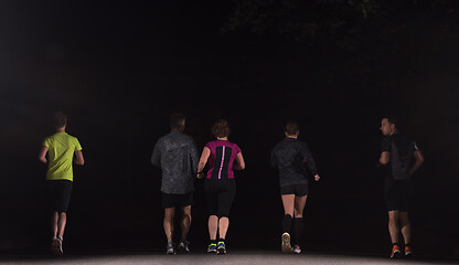 Image showing runners team on the night training