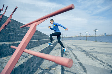 Image showing Man running on city background at morning.