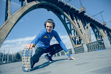 Image showing Man running on city background at morning