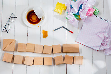 Image showing Message in wooden cubes on a desk background.