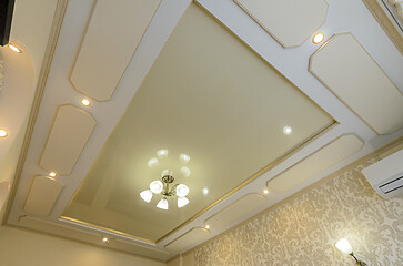 Image showing Original multi-level stretch ceiling with plasterboard elements in the bedroom interior