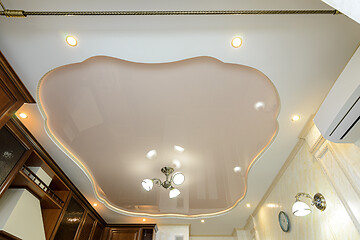 Image showing Original stylish multi-level stretch ceiling in the interior of a rich kitchen