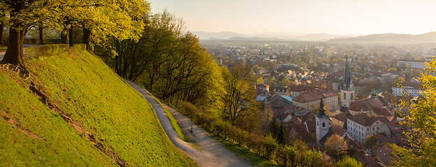 Image showing Panoramic view of Ljubljana, capital of Slovenia. Roooftops of Ljubljanas old medieval city center seen from Ljubljanas castle park at sunset