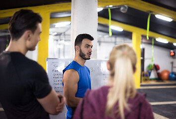 Image showing athletes getting instructions from trainer