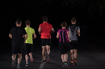 Image showing runners team on the night training