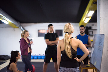 Image showing athletes getting instructions from trainer