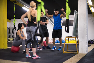 Image showing athletes getting instructions from trainer