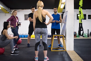 Image showing athletes getting instructions from trainer