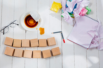 Image showing Message in wooden cubes on a desk background.