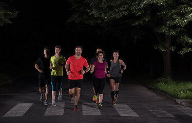 Image showing runners team on the night training