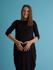 Image showing Portrait of pregnant woman over blue background