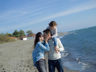 Image showing Young happy family enjoying vecation during autumn day