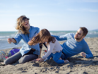 Image showing Young happy family enjoying vecation during autumn day