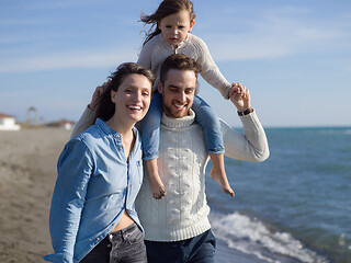 Image showing Young happy family enjoying vecation during autumn day