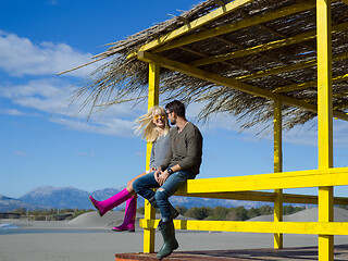 Image showing young couple drinking beer together at the beach