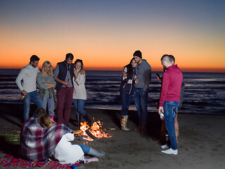 Image showing Friends having fun at beach on autumn day