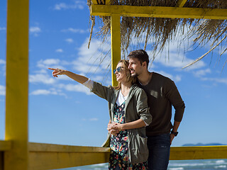 Image showing Couple chating and having fun at beach bar