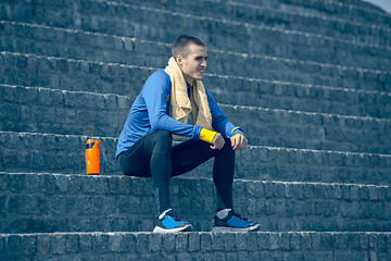 Image showing Man on city background at morning. Healthy lifestyle concept.
