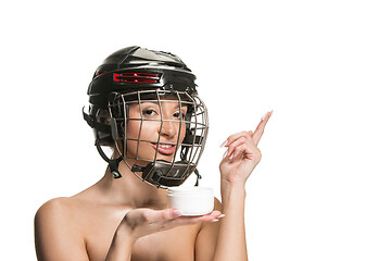 Image showing Female hockey player in helmet and mask