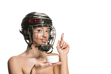 Image showing Female hockey player in helmet and mask