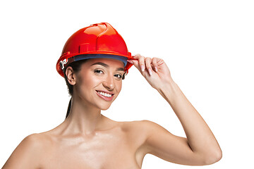 Image showing Portrait of confident female worker in orange helmet