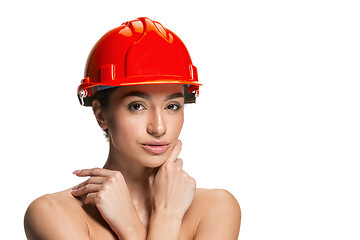 Image showing Portrait of confident female worker in orange helmet