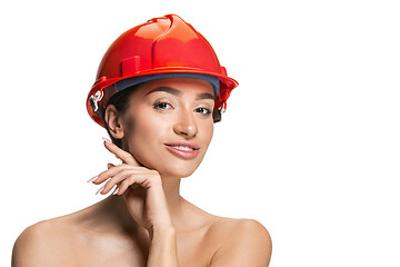 Image showing Portrait of confident female worker in orange helmet