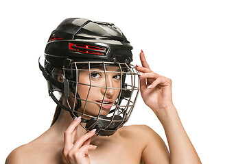 Image showing Female hockey player in helmet and mask