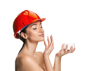 Image showing Portrait of confident female worker in orange helmet