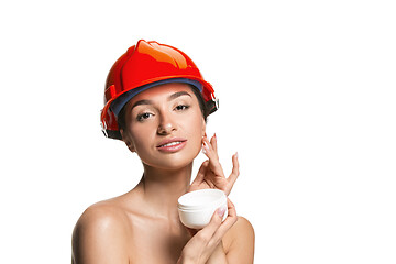 Image showing Portrait of confident female worker in orange helmet