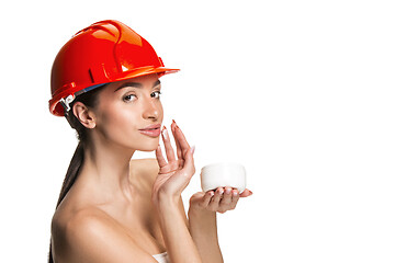 Image showing Portrait of confident female worker in orange helmet