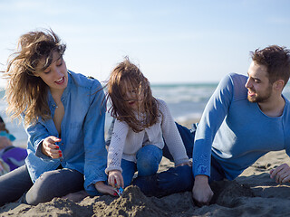 Image showing Young happy family enjoying vecation during autumn day