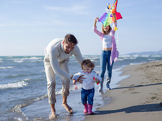 Image showing happy family enjoying vecation during autumn day