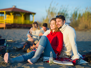 Image showing couple on a beach at autumn sunny day