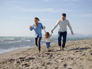 Image showing Young happy family enjoying vecation during autumn day