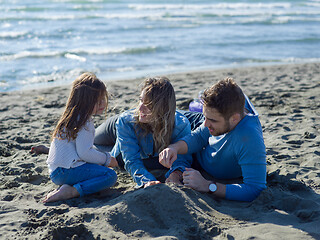 Image showing Young happy family enjoying vecation during autumn day