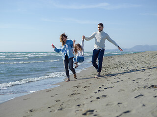 Image showing Young happy family enjoying vecation during autumn day