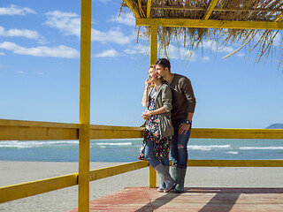 Image showing Couple chating and having fun at beach bar