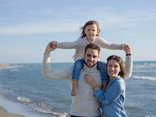 Image showing Young happy family enjoying vecation during autumn day