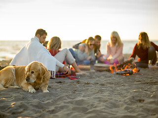 Image showing Friends having fun at beach on autumn day