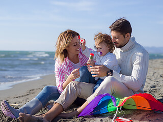 Image showing Young family enjoying vecation during autumn day