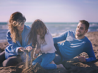 Image showing Young family enjoying vecation during autumn day